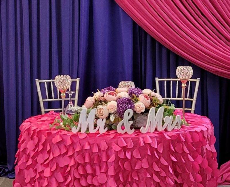 Event Decor Setup by The Party Place Banquet & Events Venue in Orange Park, Florida -Pink and Purple Wedding Sweetheart Table