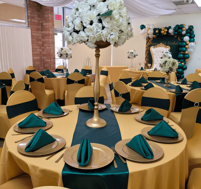 Event Decor Setup by The Party Place Banquet & Events Venue in Orange Park, Florida - Custom Floral Centerpiece on Gold and Green Table Setting